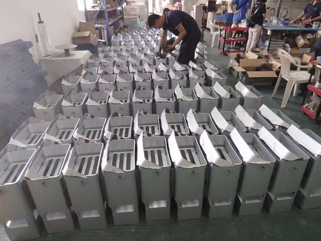 Finished sauna control boxes lined up for final inspection